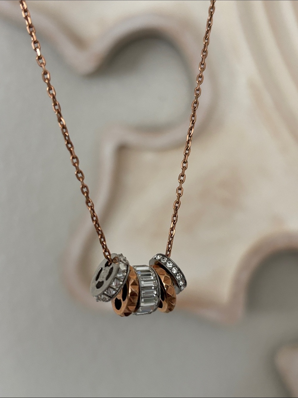 Henri Bendel multi charm necklace in rose gold toned